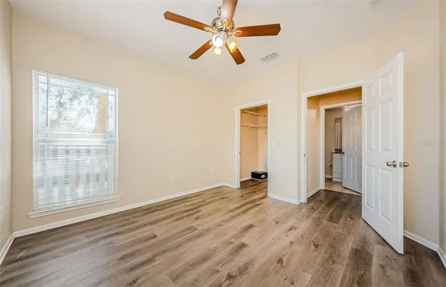 a bathroom with a granite countertop sink a toilet and a bathtub