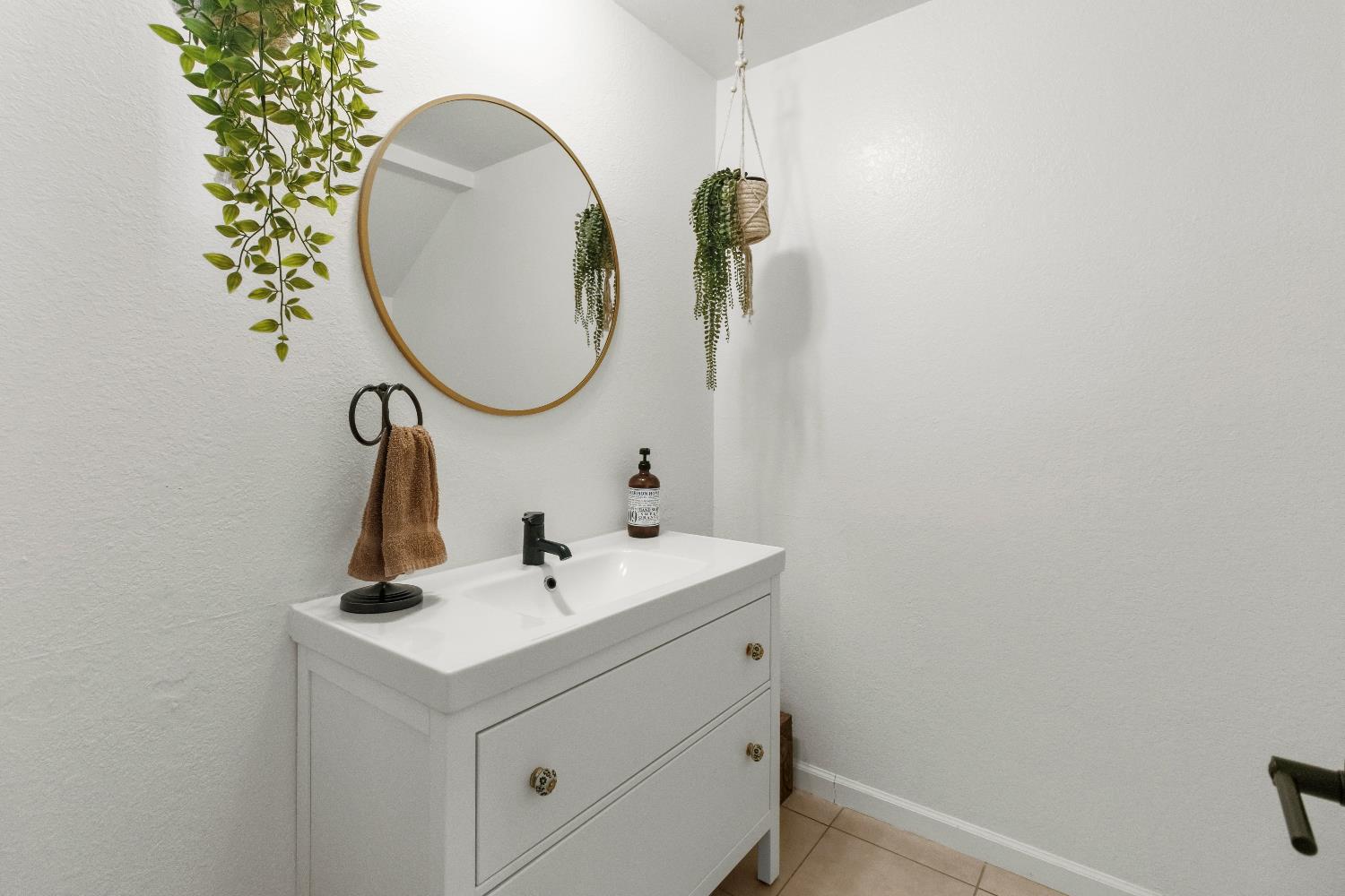 7428 Ranch Avenue Citrus Heights, CA 95610 - Photo 14 of 49 a bathroom with a sink and a mirror