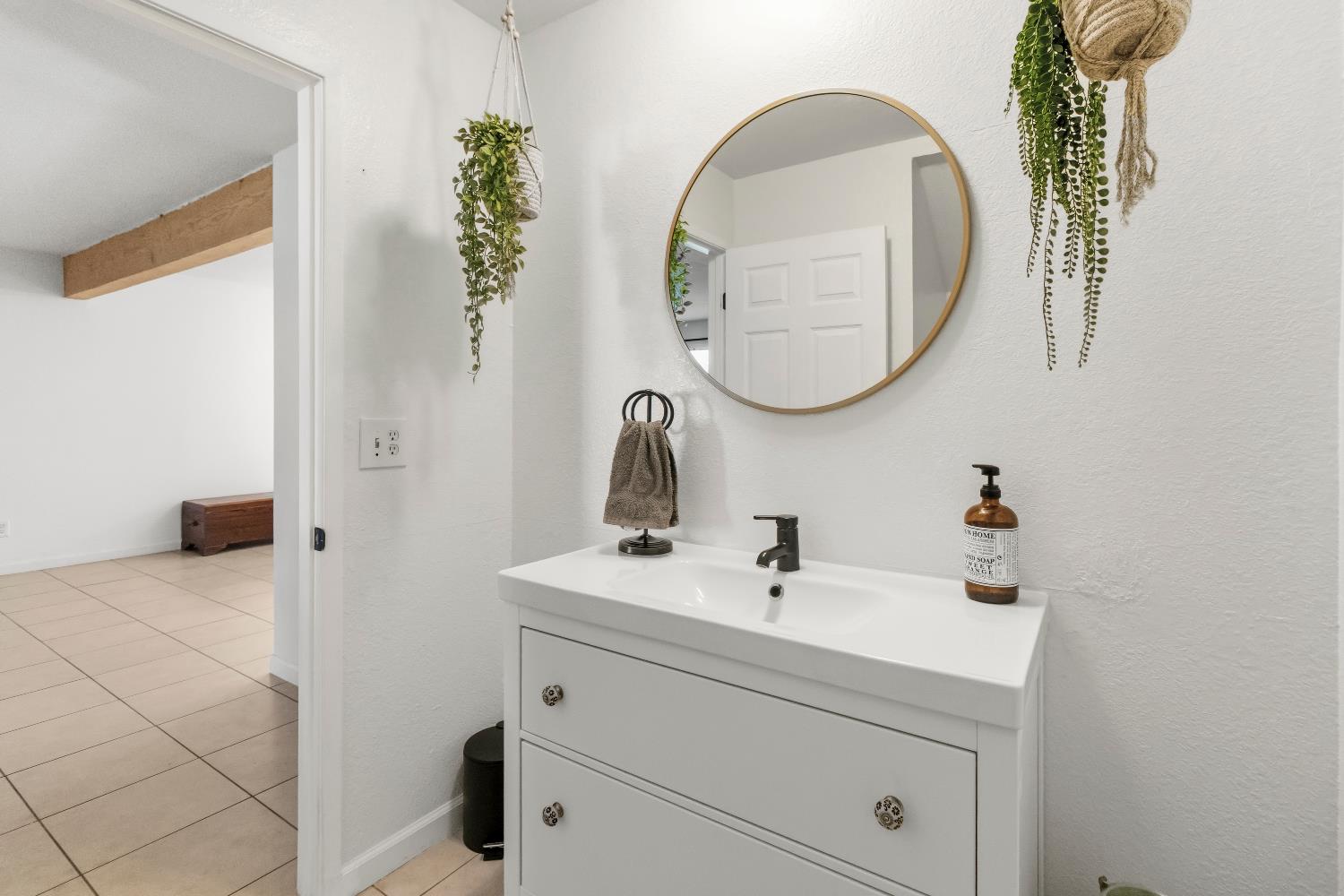 7428 Ranch Avenue Citrus Heights, CA 95610 - Photo 15 of 49 a bathroom with a sink and a mirror