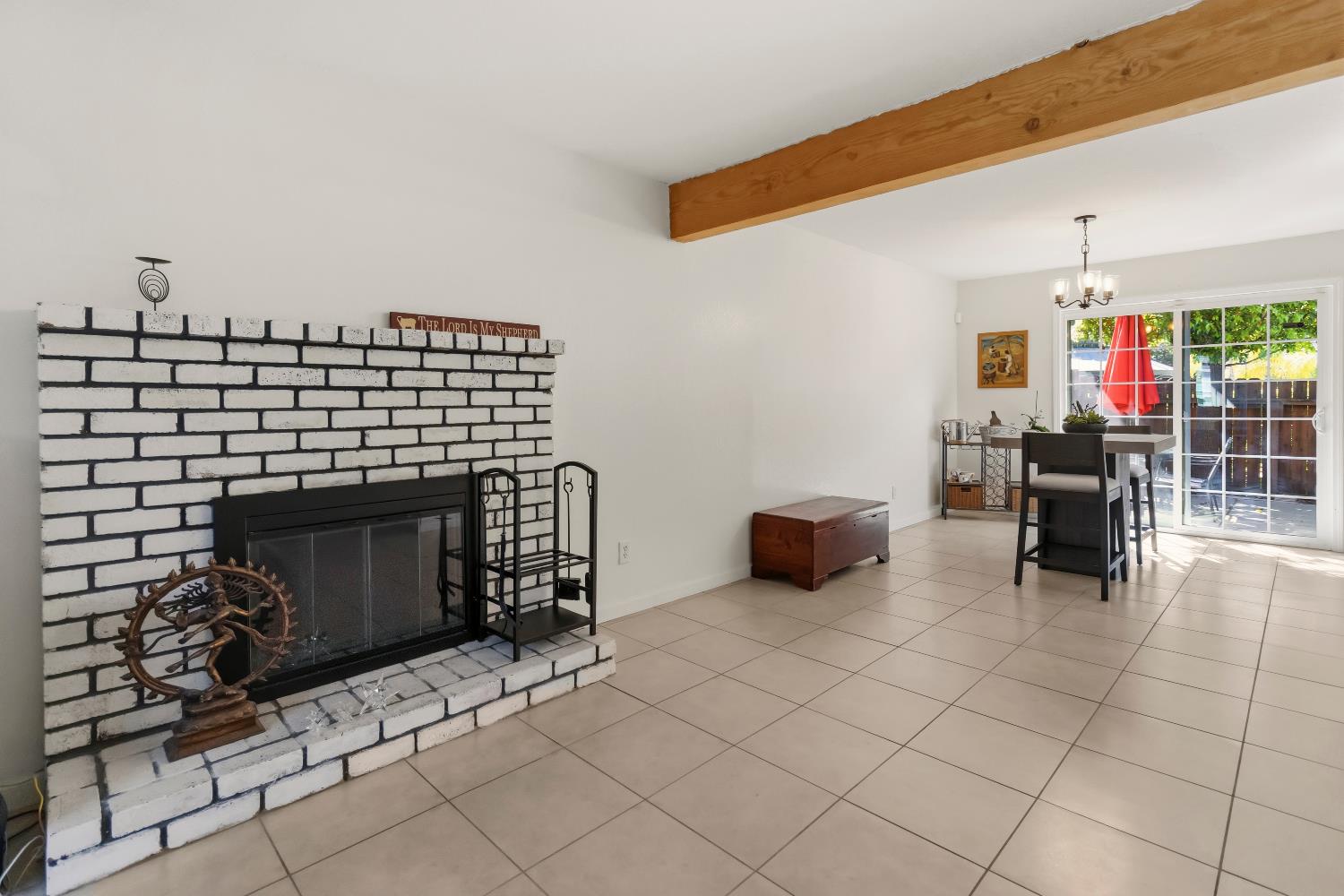7428 Ranch Avenue Citrus Heights, CA 95610 - Photo 17 of 49 a living room with furniture a fireplace and a table