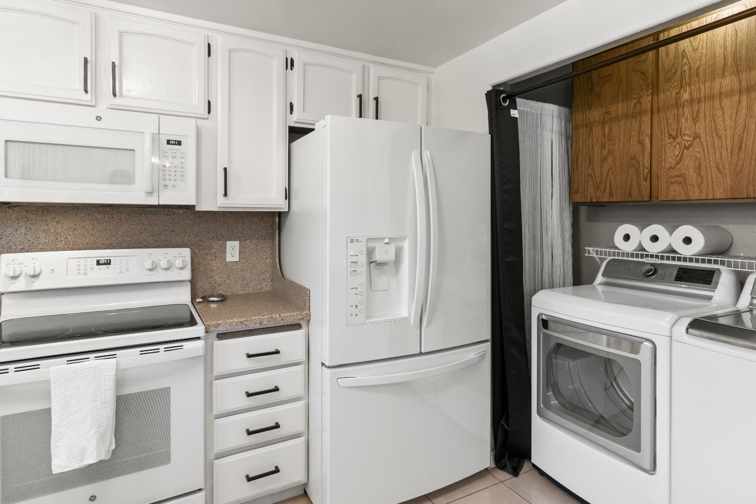 7428 Ranch Avenue Citrus Heights, CA 95610 - Photo 24 of 49 a kitchen with cabinets stainless steel appliances and a refrigerator