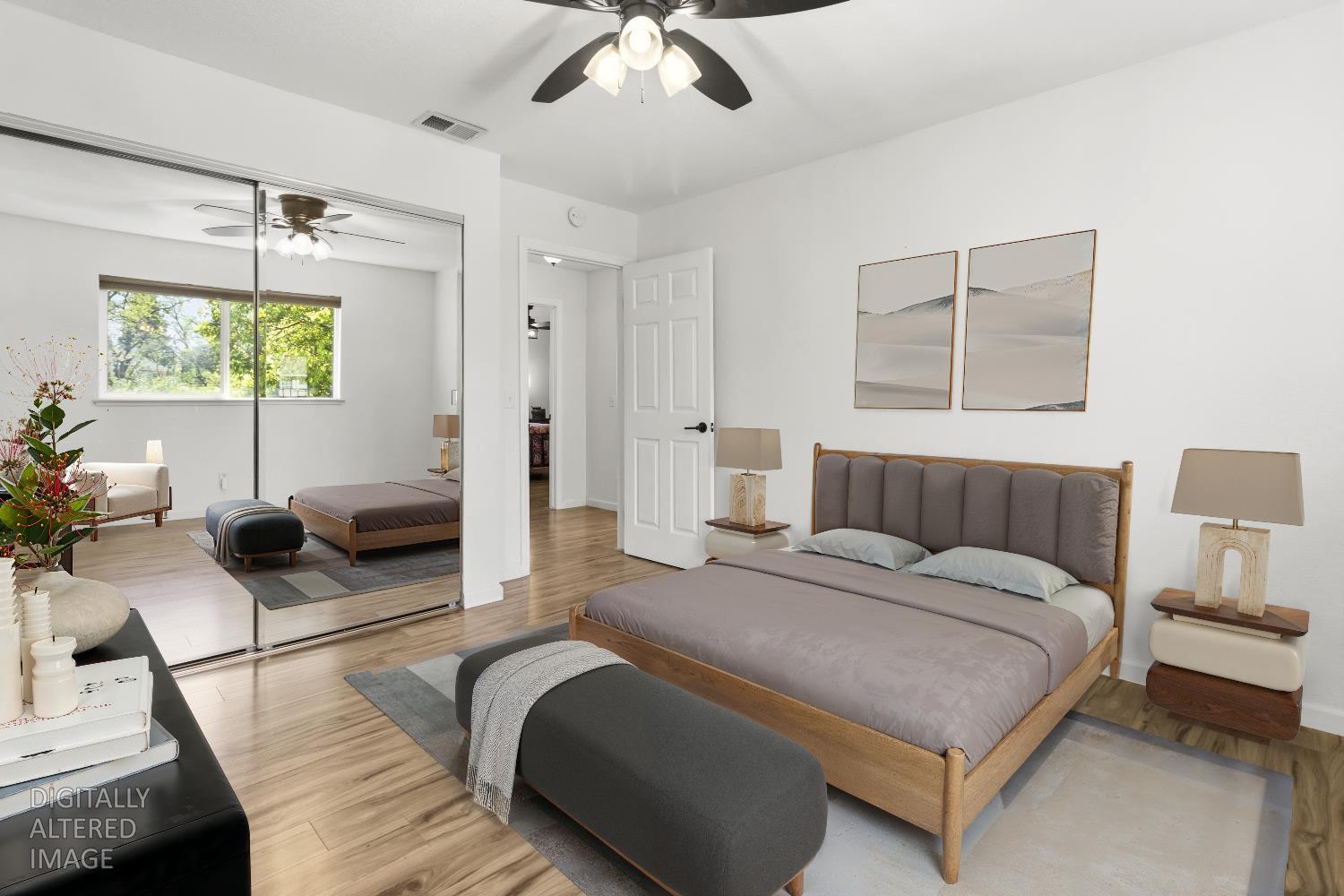 7428 Ranch Avenue Citrus Heights, CA 95610 - Photo 29 of 49 a spacious bedroom with a bed a couch and a flat tv screen on the dresser