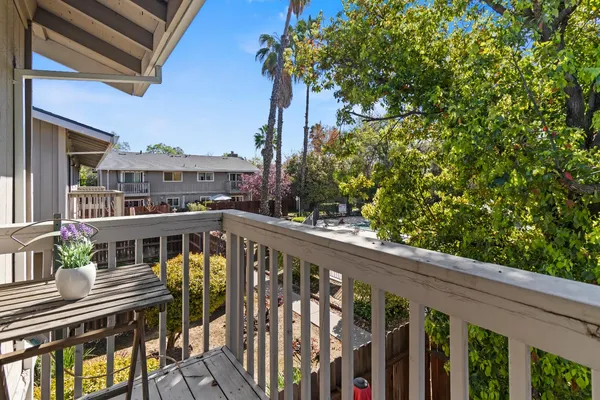 a view of balcony with furniture