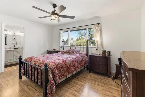a bedroom with a bed and a desk