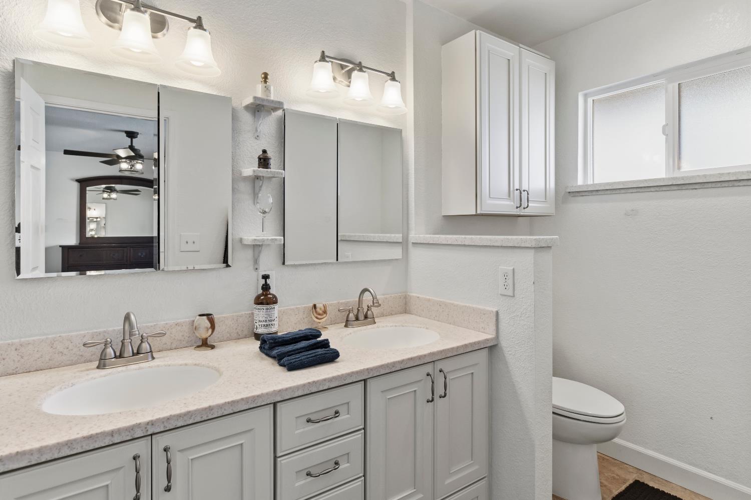 7428 Ranch Avenue Citrus Heights, CA 95610 - Photo 42 of 49 a bathroom with a sink a toilet and a mirror