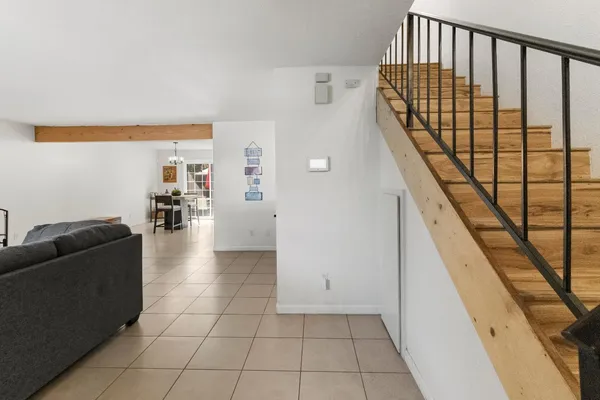 a view of livingroom with furniture and stairs