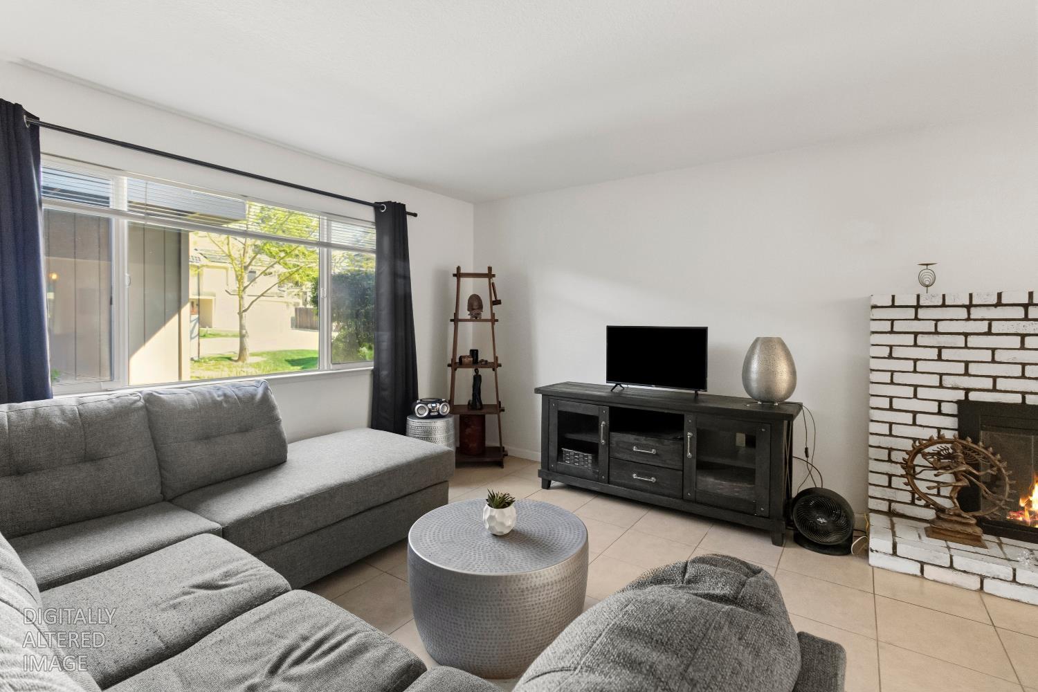 7428 Ranch Avenue Citrus Heights, CA 95610 - Photo 7 of 49 a living room with furniture and a flat screen tv