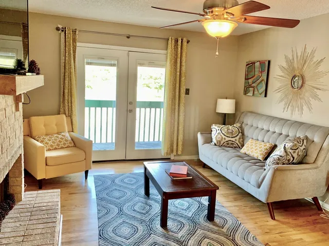 a living room with furniture and a window
