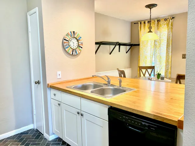 a bathroom with a sink and a window