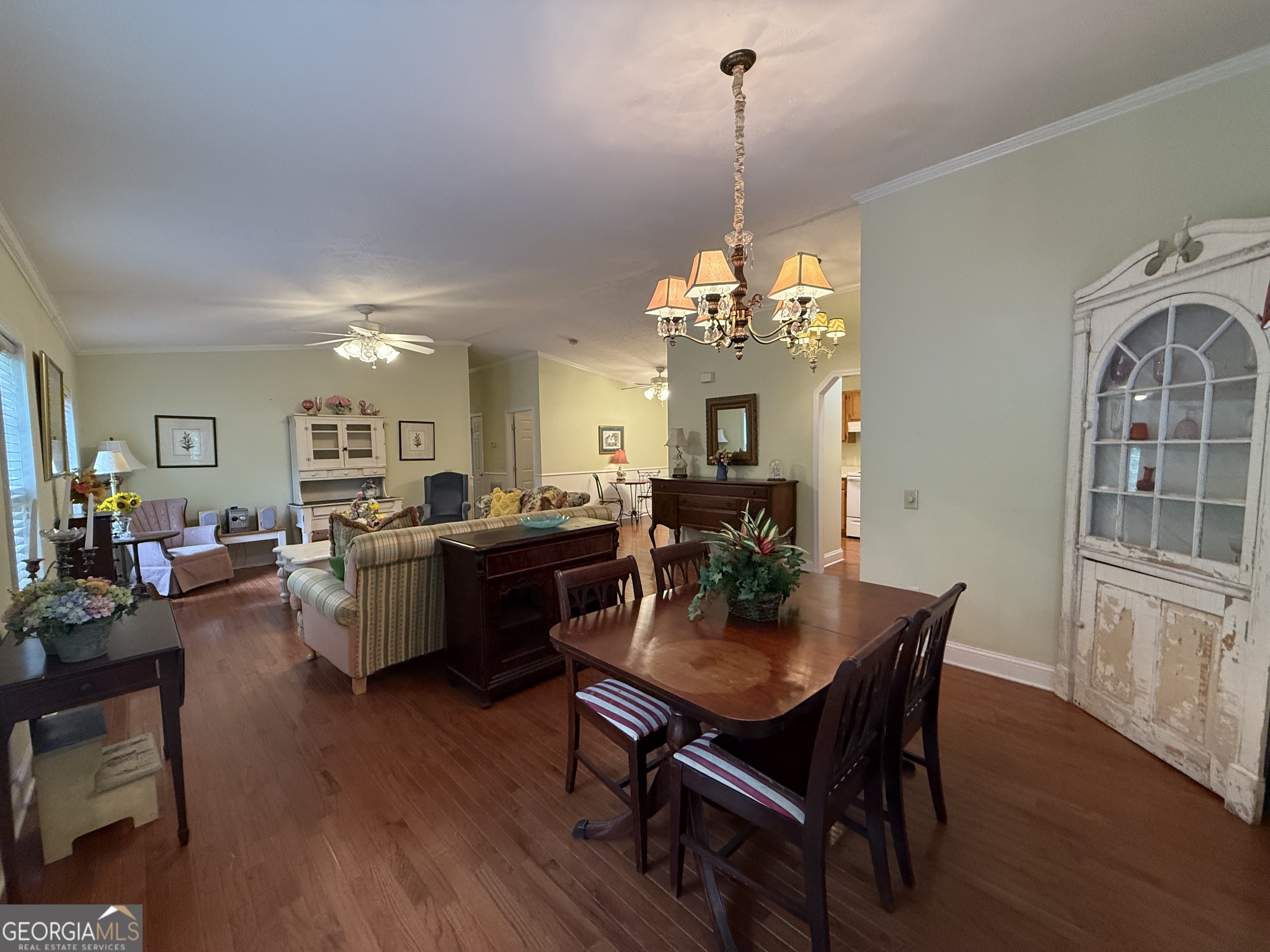 1081 Marshall Church Road Thomson, GA 30824 - Photo 6 of 26 a view of a dining room with furniture and wooden floor