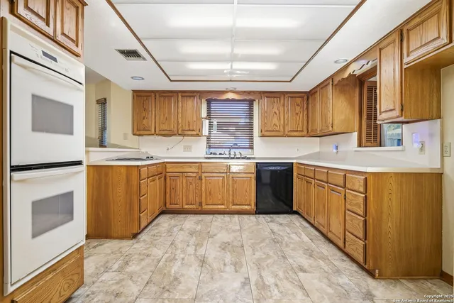 a view of a room with window wooden floor and a chandelier