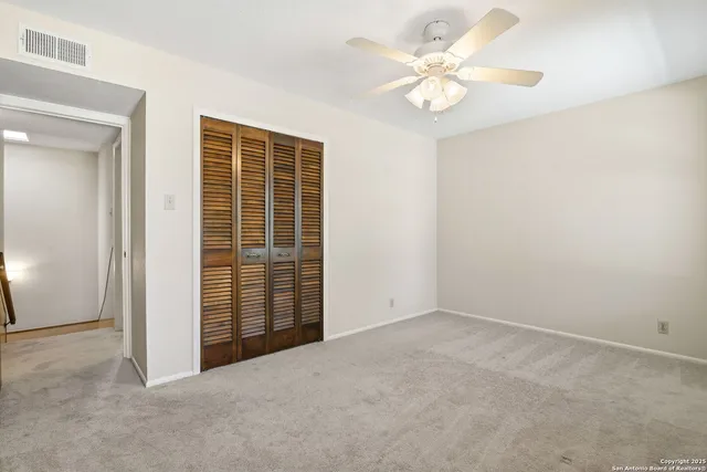 a view of storage and utility room with wooden floor