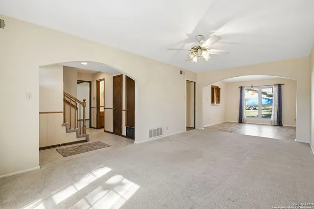 a view of a hallway with a chandelier