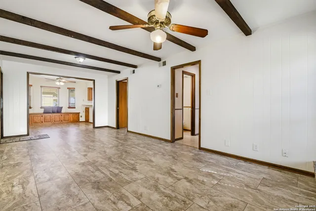 a view of livingroom with hardwood floor and a ceiling fan
