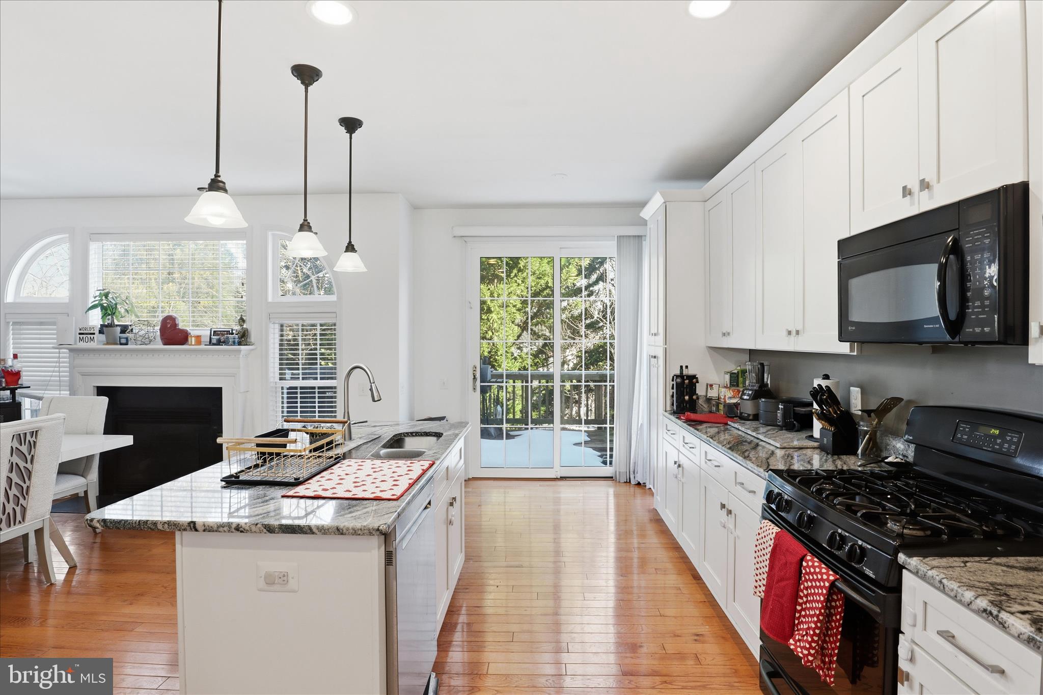 9285 Laurel Ridge Crossing Road Lorton, VA 22079 - Photo 15 of 41 a kitchen with sink stove and cabinets