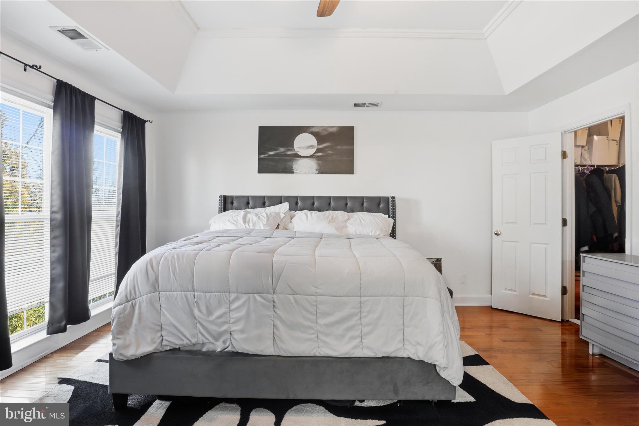 9285 Laurel Ridge Crossing Road Lorton, VA 22079 - Photo 19 of 41 a bedroom with a bed and wooden floor