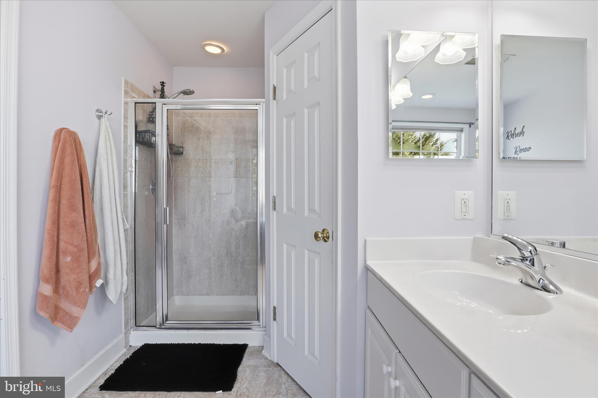 9285 Laurel Ridge Crossing Road Lorton, VA 22079 - Photo 23 of 41 a bathroom with a sink and a mirror