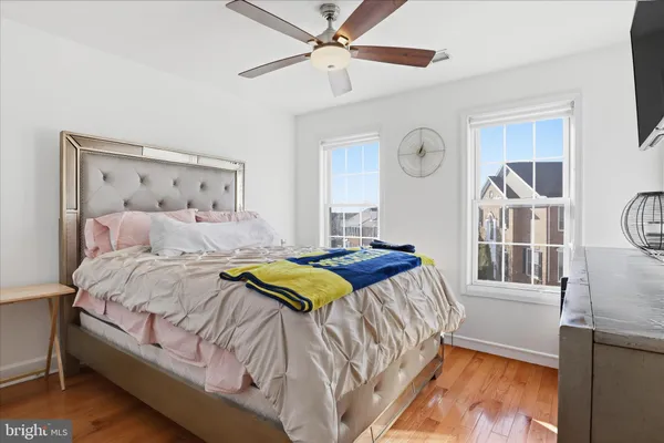 a bedroom with a bed dresser and a window