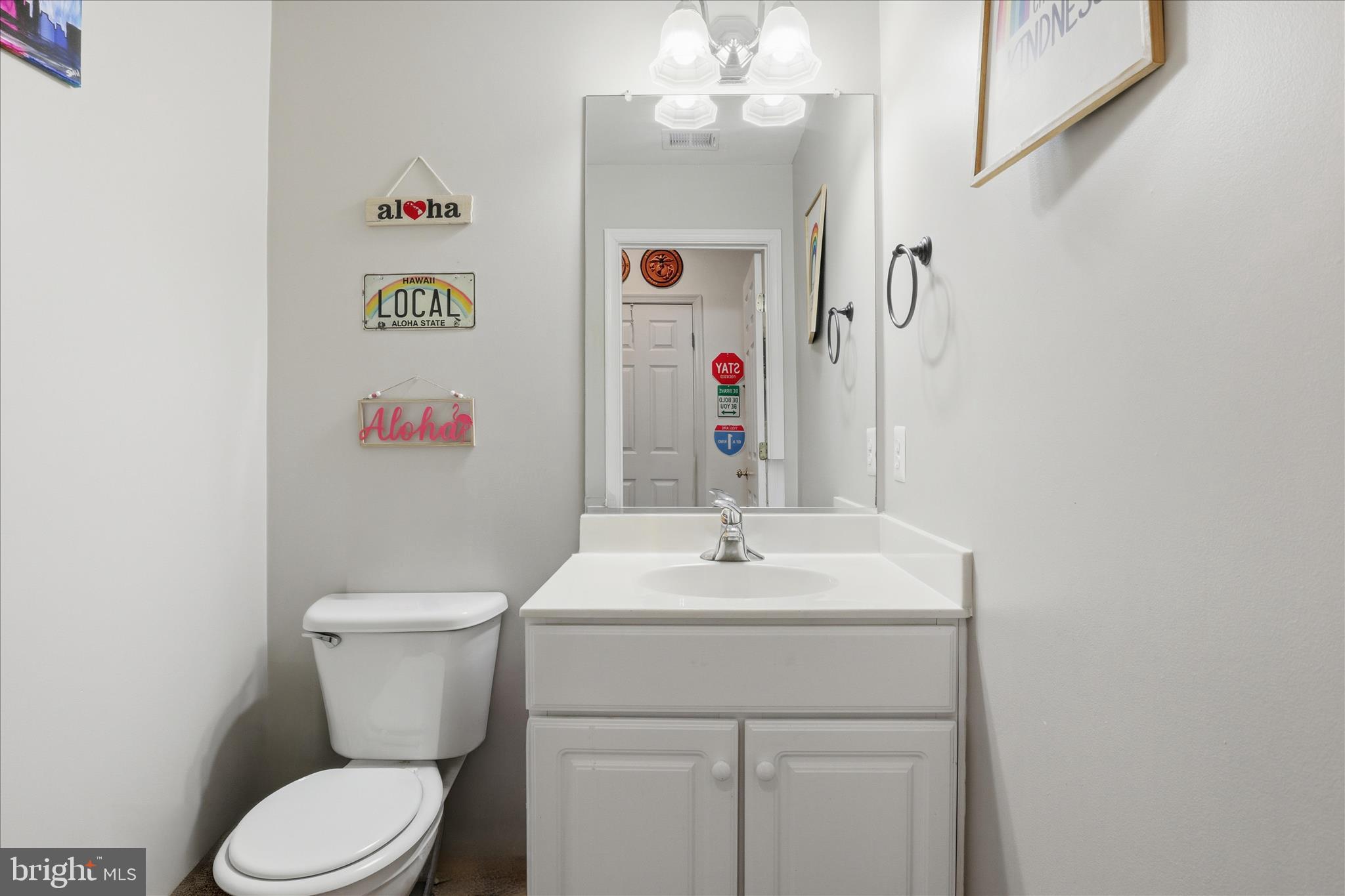9285 Laurel Ridge Crossing Road Lorton, VA 22079 - Photo 29 of 41 a bathroom with a sink a toilet and a mirror
