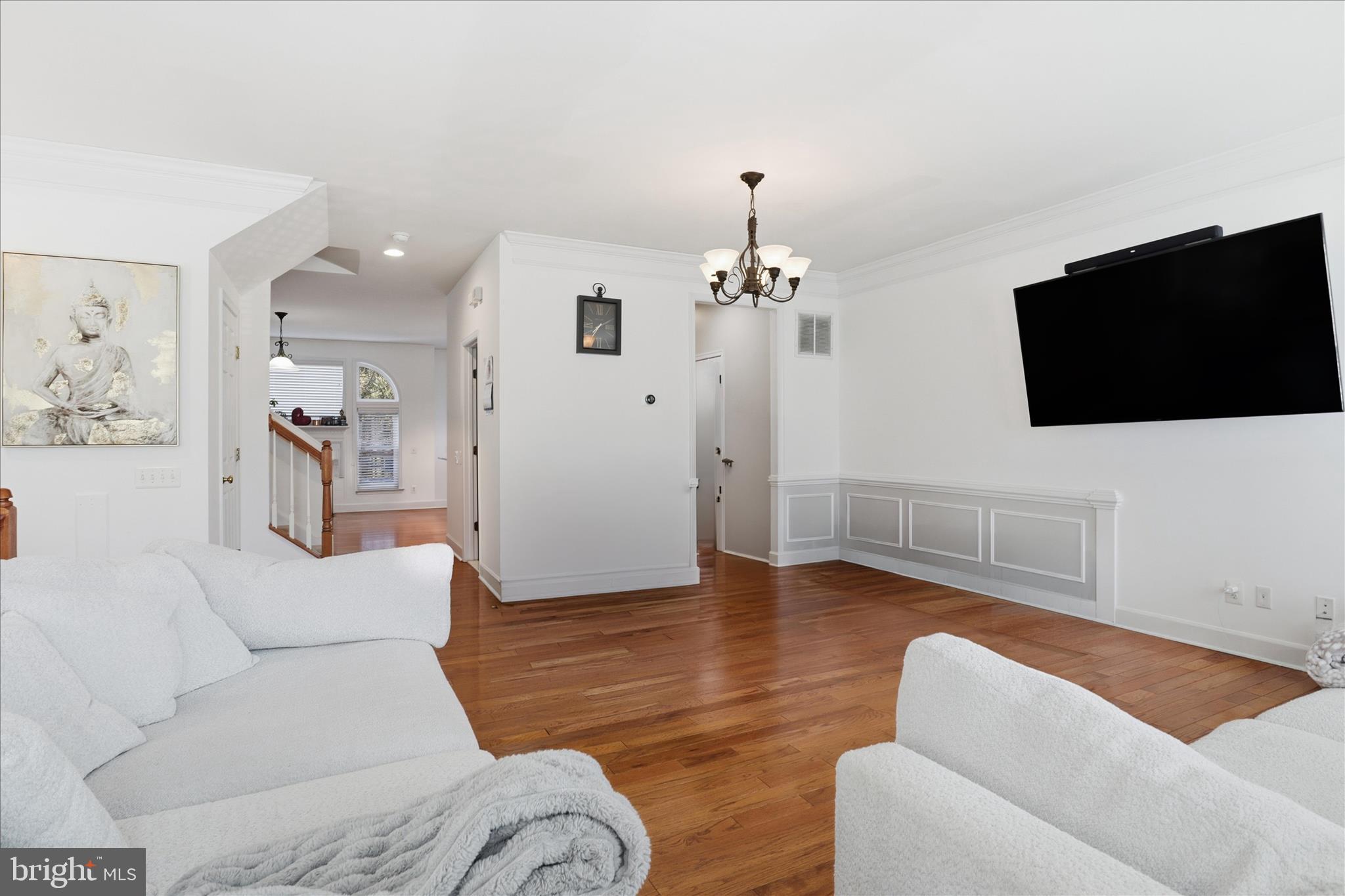 9285 Laurel Ridge Crossing Road Lorton, VA 22079 - Photo 9 of 41 a living room with furniture and a flat screen tv
