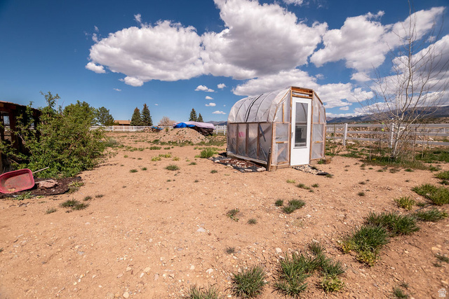 745 East 885 North Beaver, UT 84713 - Photo 39 of 50 View of yard with a greenhouse and an outbuilding