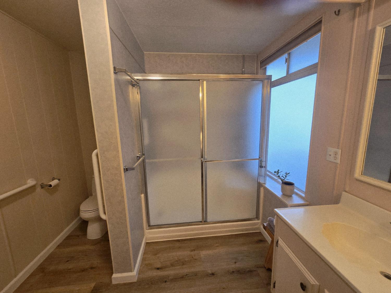 1300 West Olson Avenue, Unit 73 Reedley, CA 93654 - Photo 15 of 23 a bathroom with a shower and a sink