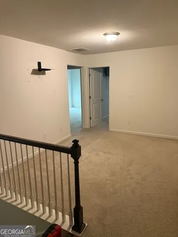 a view of hallway with stairs