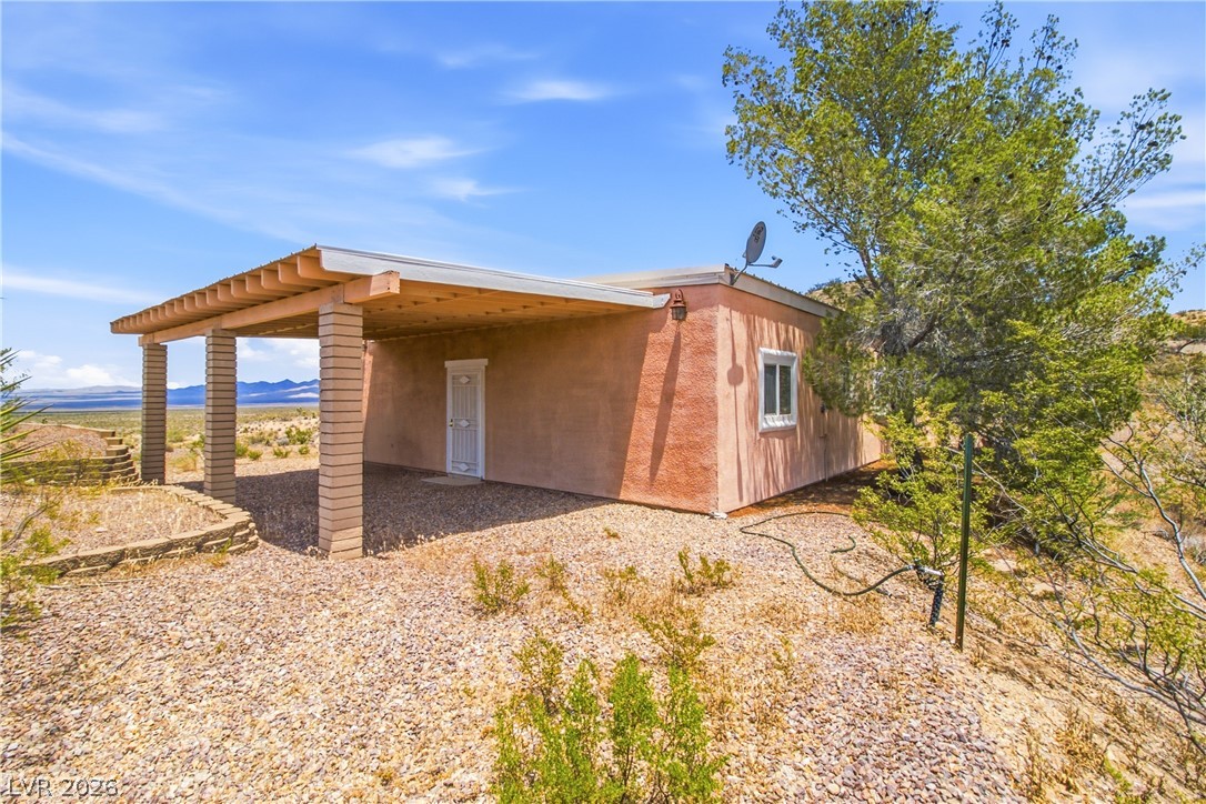 Rocking S Ranch Road Searchlight, NV 89046 - Photo 16 of 47 A charming stucco home with a covered patio provides a cool desert retreat with expansive views.