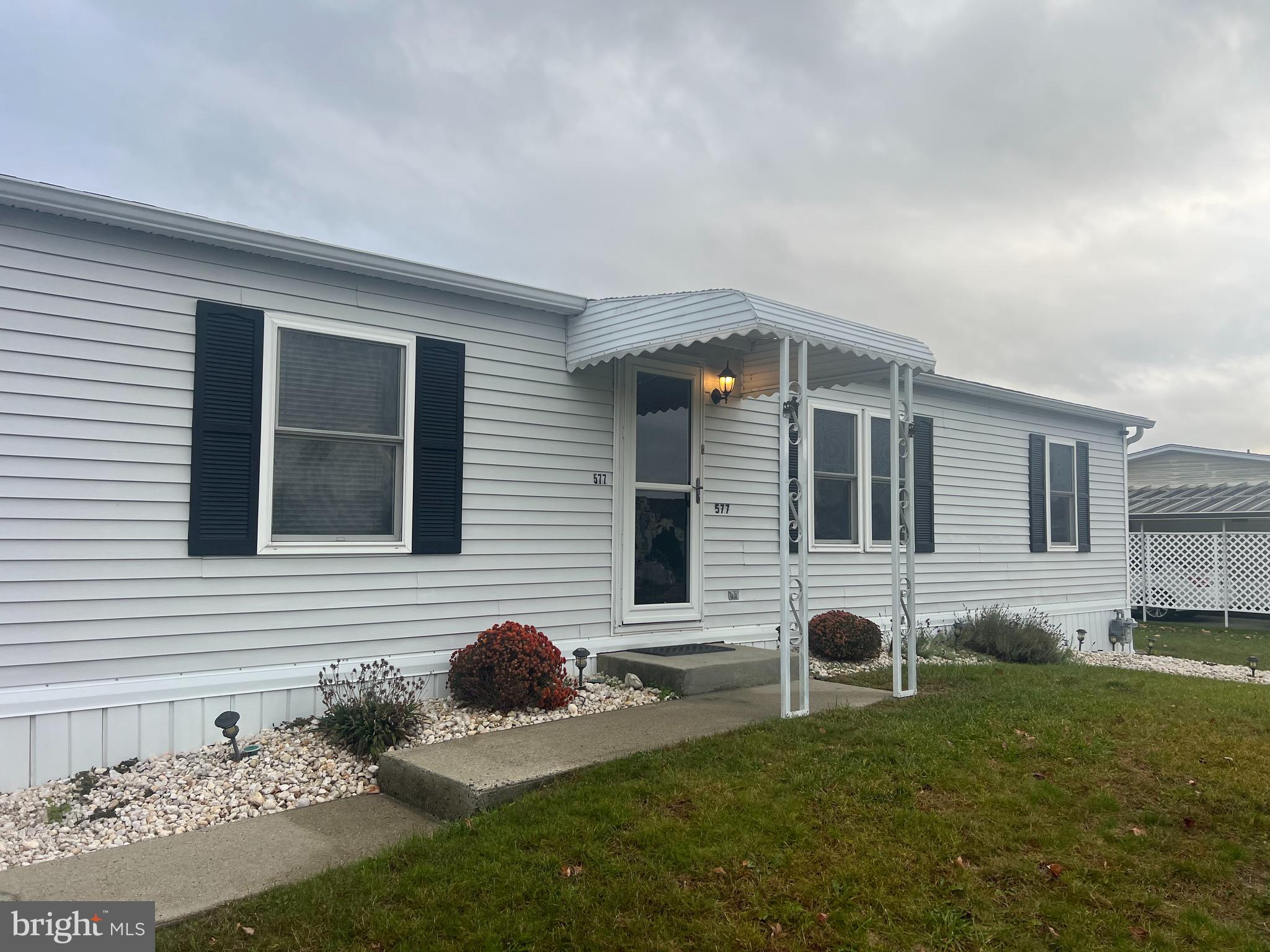 577 Miles Standish Lane Buena, NJ 08310 - Photo 2 of 7 a front view of a house with a yard