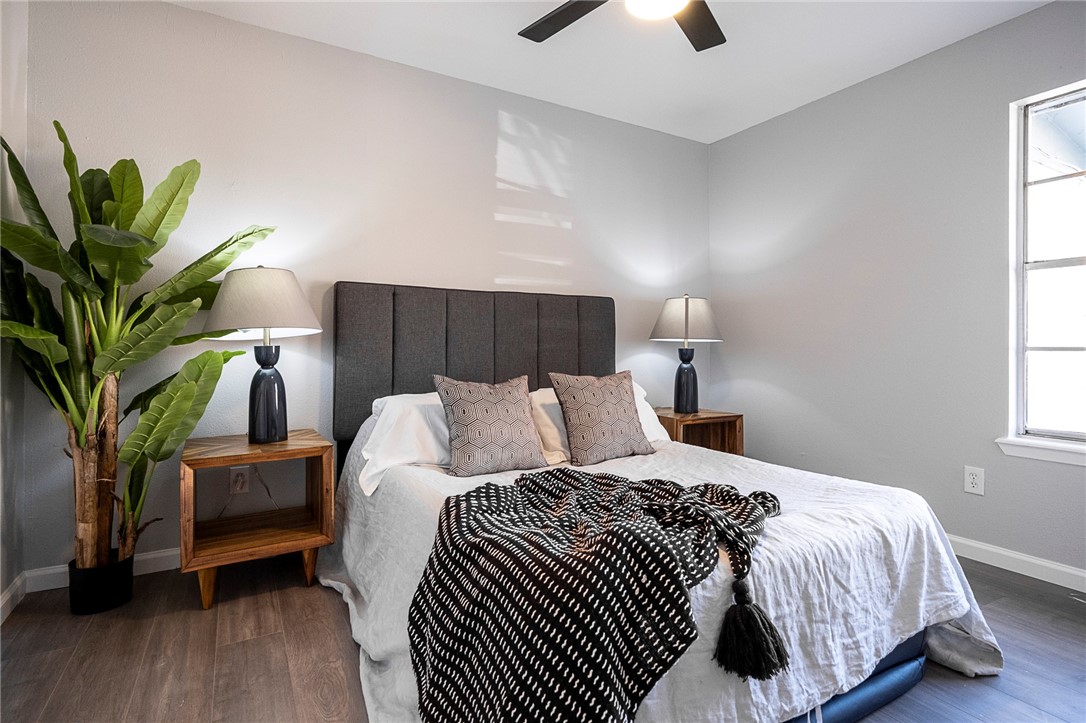 4900 Hawk Cove, Unit A Austin, TX 78745 - Photo 15 of 23 a bedroom with a bed and a potted plant
