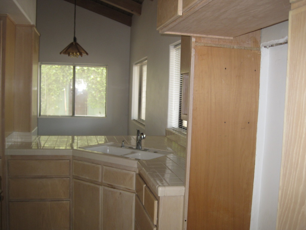 1186 Palomino Road Santa Barbara, CA 93105 - Photo 18 of 21 a bathroom with a granite countertop sink a mirror and a shower