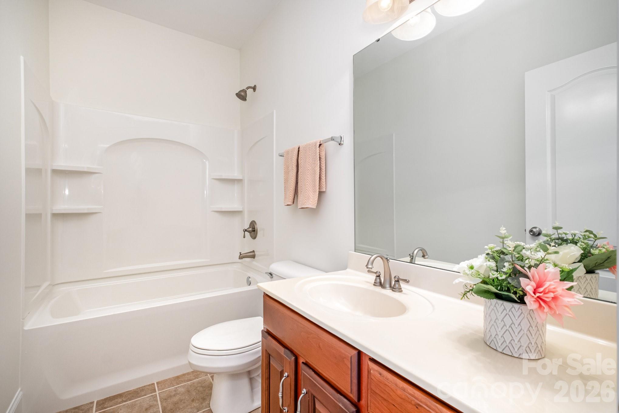 5019 Mesa Verde Road Charlotte, NC 28277 - Photo 27 of 40 a bathroom with a sink a toilet and shower