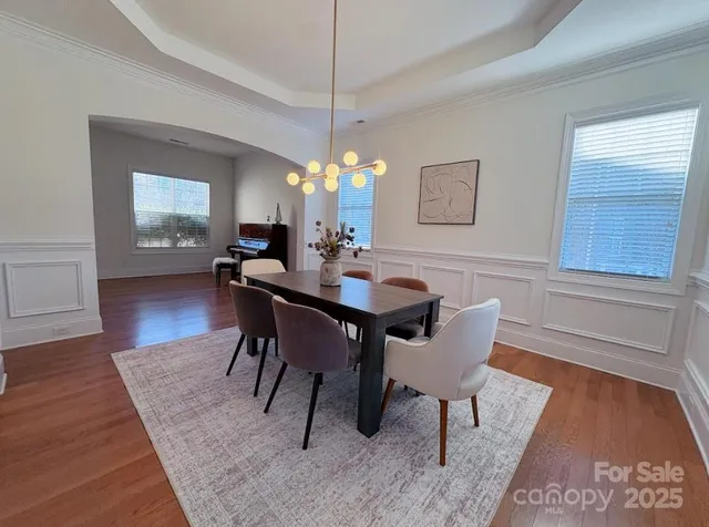 a bathroom with a sink a toilet a mirror and shower