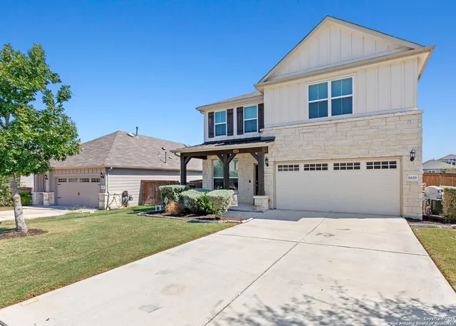 a view of a house with a garden