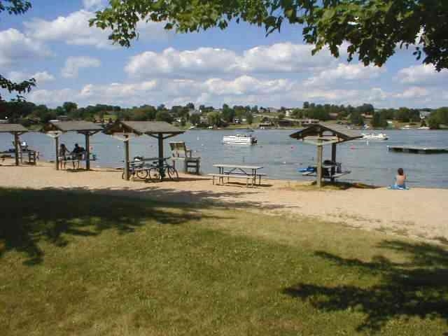 1322 Lake Summerset Road Lake Summerset, IL 61019 - Photo 5 of 13 a view of a lake with houses in the back
