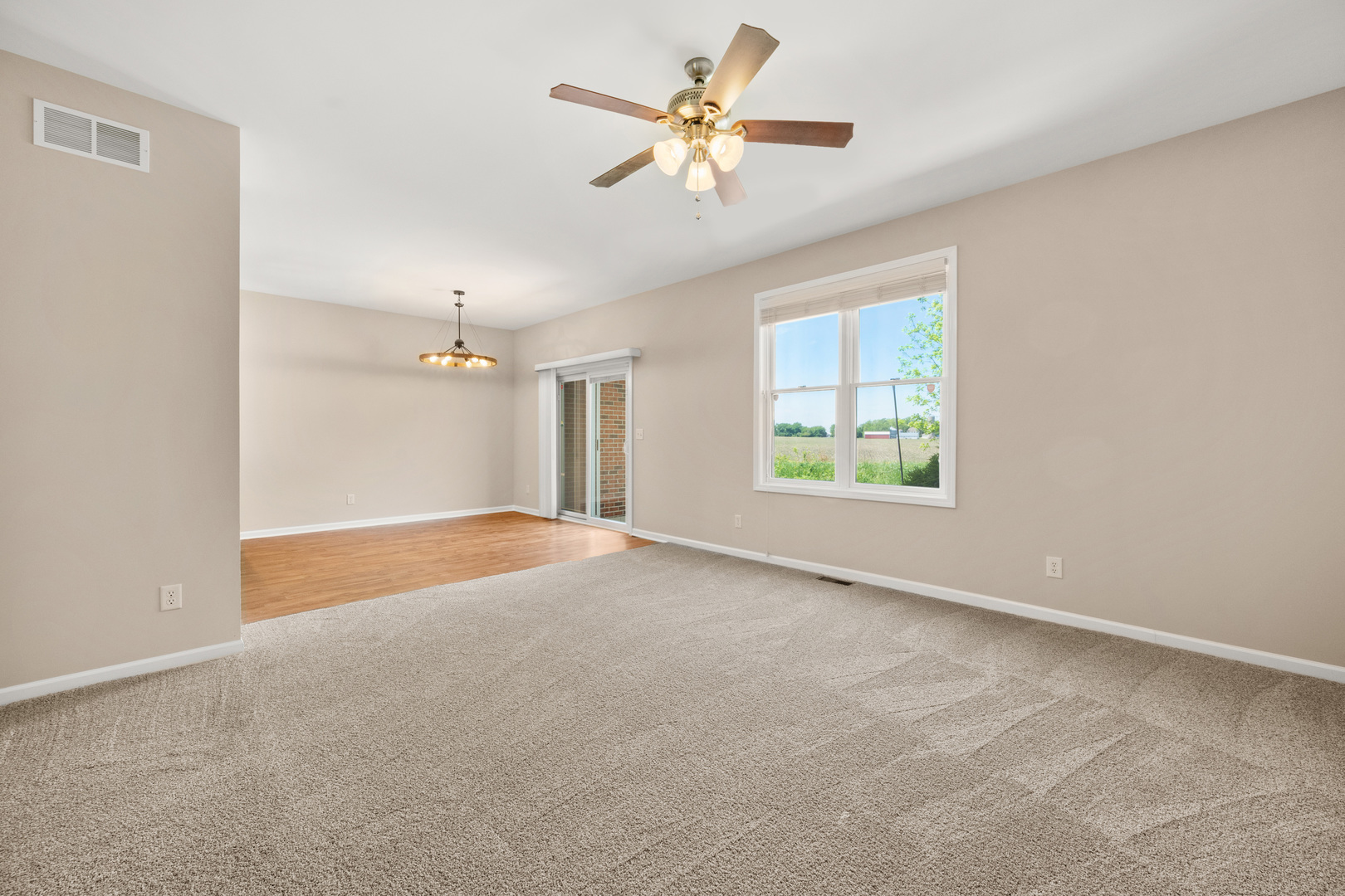3705 Green Tree Lane DeKalb, IL 60115 - Photo 6 of 31 a view of an empty room with a window