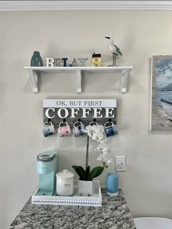 a table with wine bottles and plates