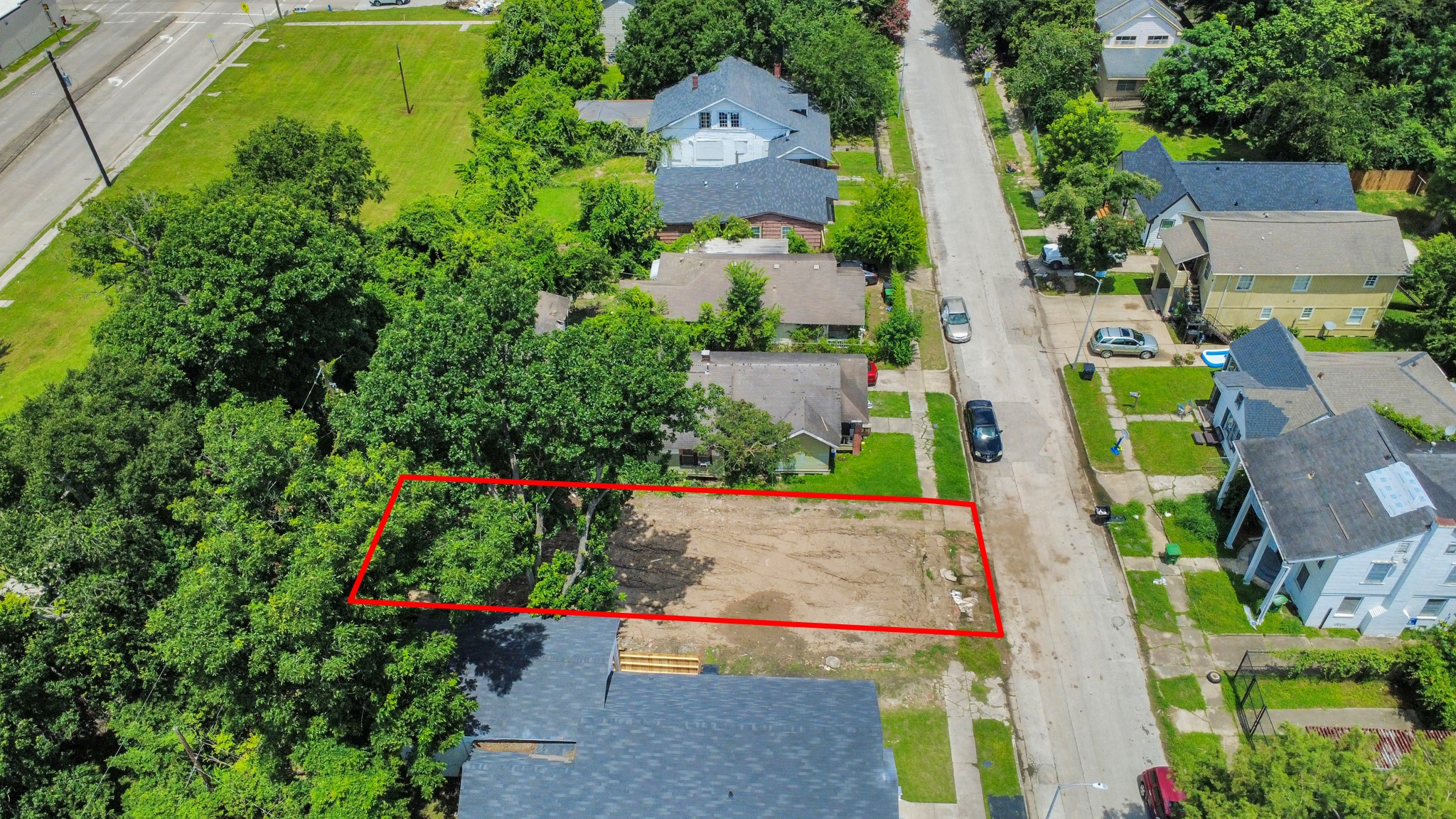 2828 Winbern Street Houston, TX 77004 - Photo 2 of 11 an aerial view of a house with a garden and large trees