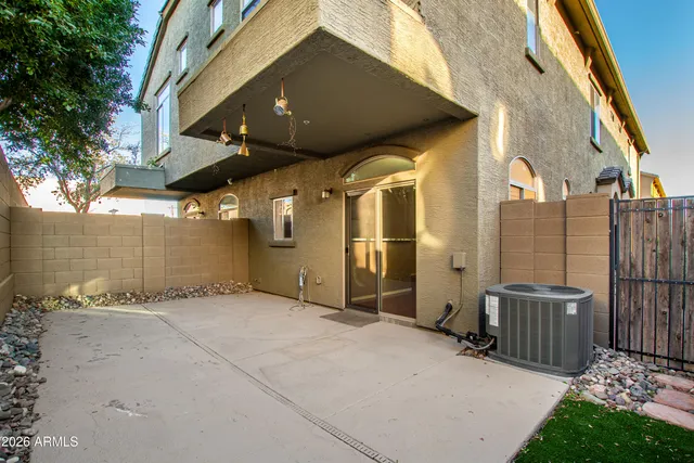 a view of a porch with wooden fence