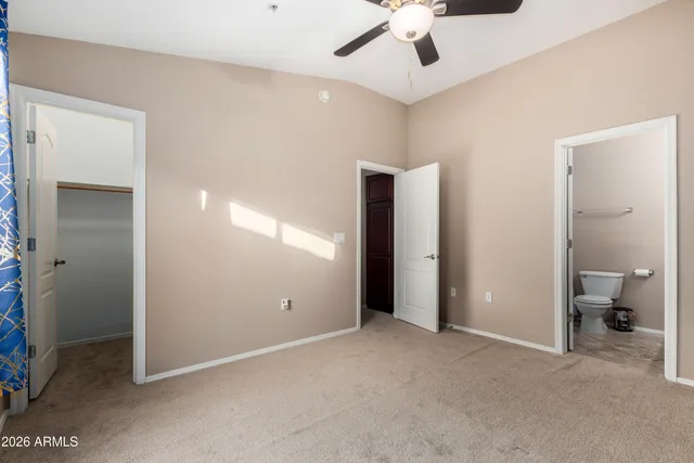 a view of an empty room with a bathroom