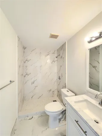 a view of a kitchen with a sink and dishwasher a stove top oven