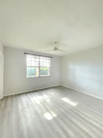a bathroom with a granite countertop toilet a sink and bathtub