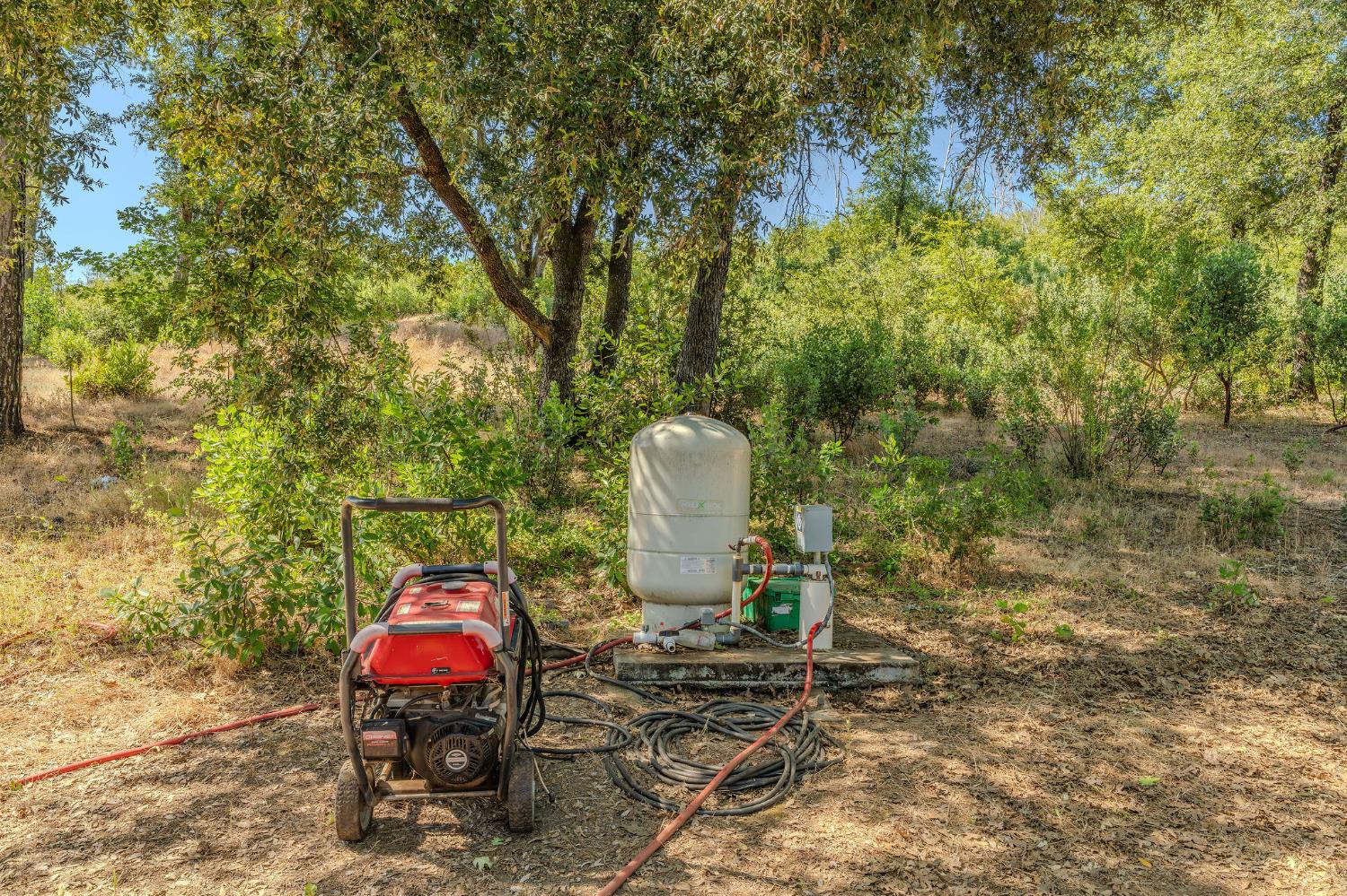 0 Hawver Road San Andreas, CA 95245 - Photo 10 of 42 a view of a wooden chairs and fire pit in the backyard