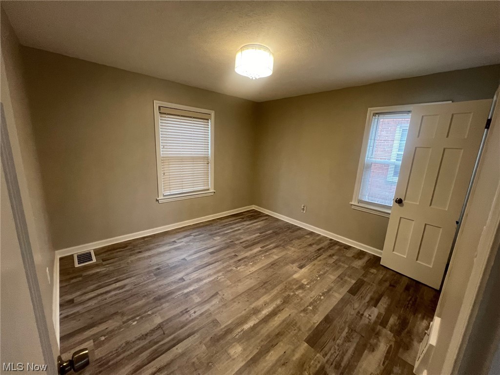 1508 Winchester Road Lyndhurst, OH 44124 - Photo 14 of 23 Empty room featuring dark hardwood / wood-style floors