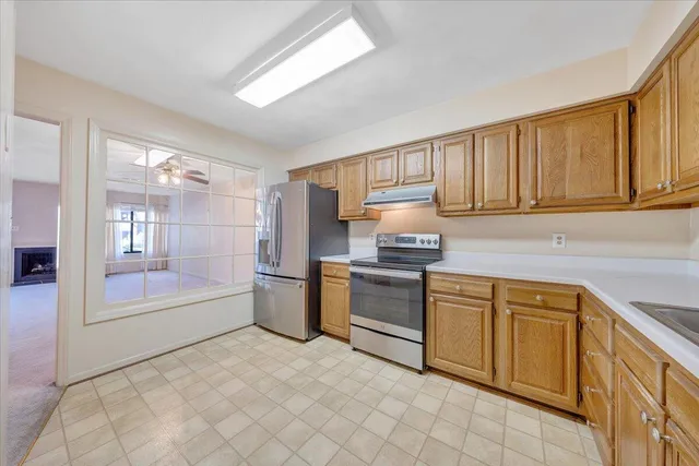 a kitchen with a sink cabinets and stainless steel appliances