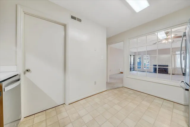 a large white bathroom with a tub and shower