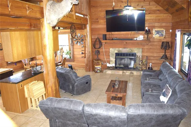 a living room with furniture and a flat screen tv