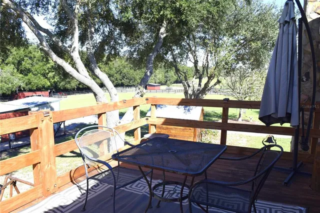 a bathroom with a sink a toilet a mirror and shower