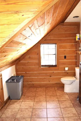 a bathroom with a toilet and a sink