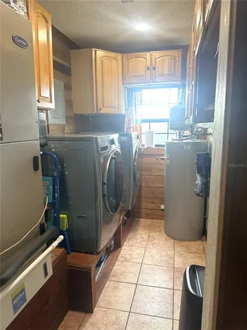 a view of a green field with wooden fence